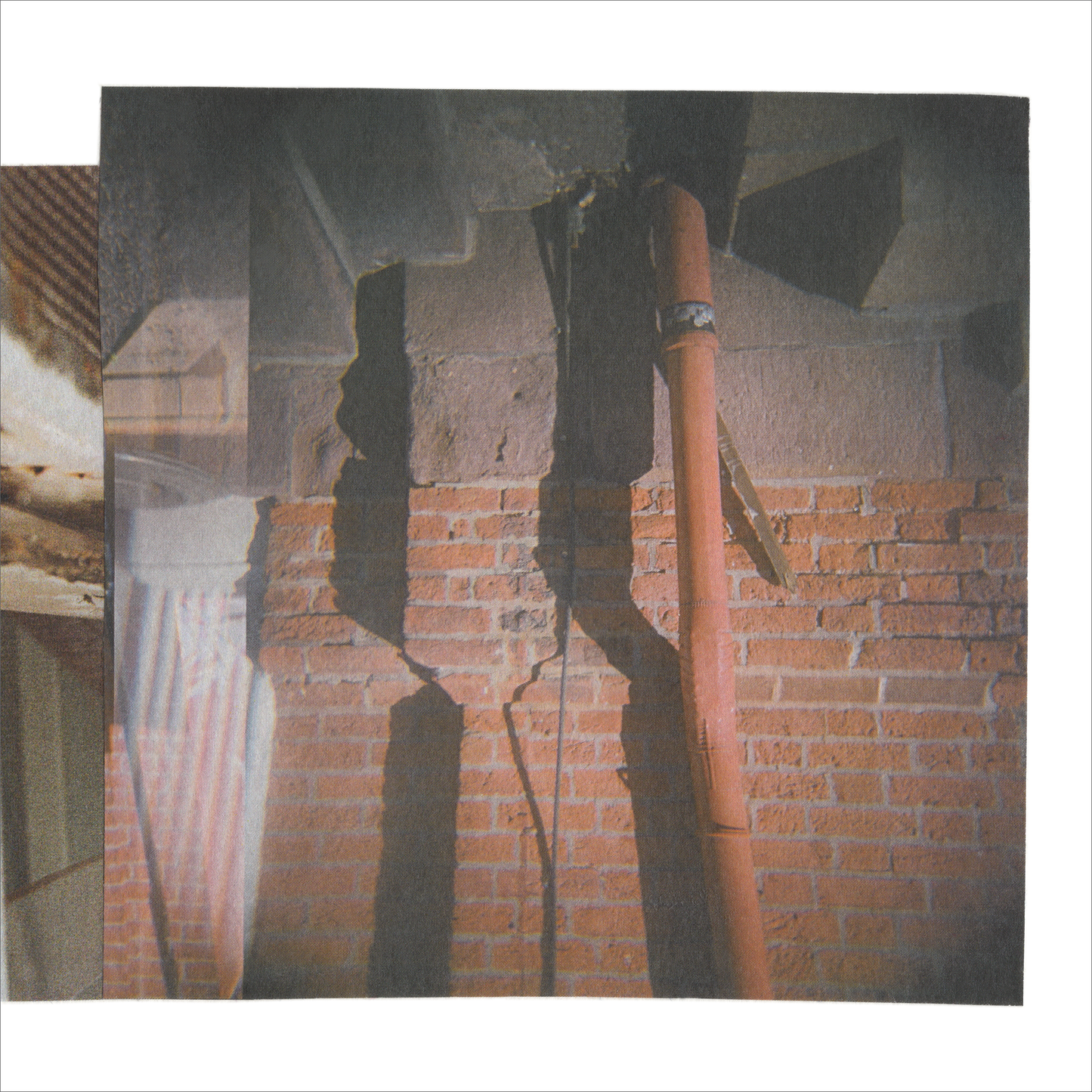 Photo collage with brick wall details and color blocks in warm, muted grays, taupes, and white.