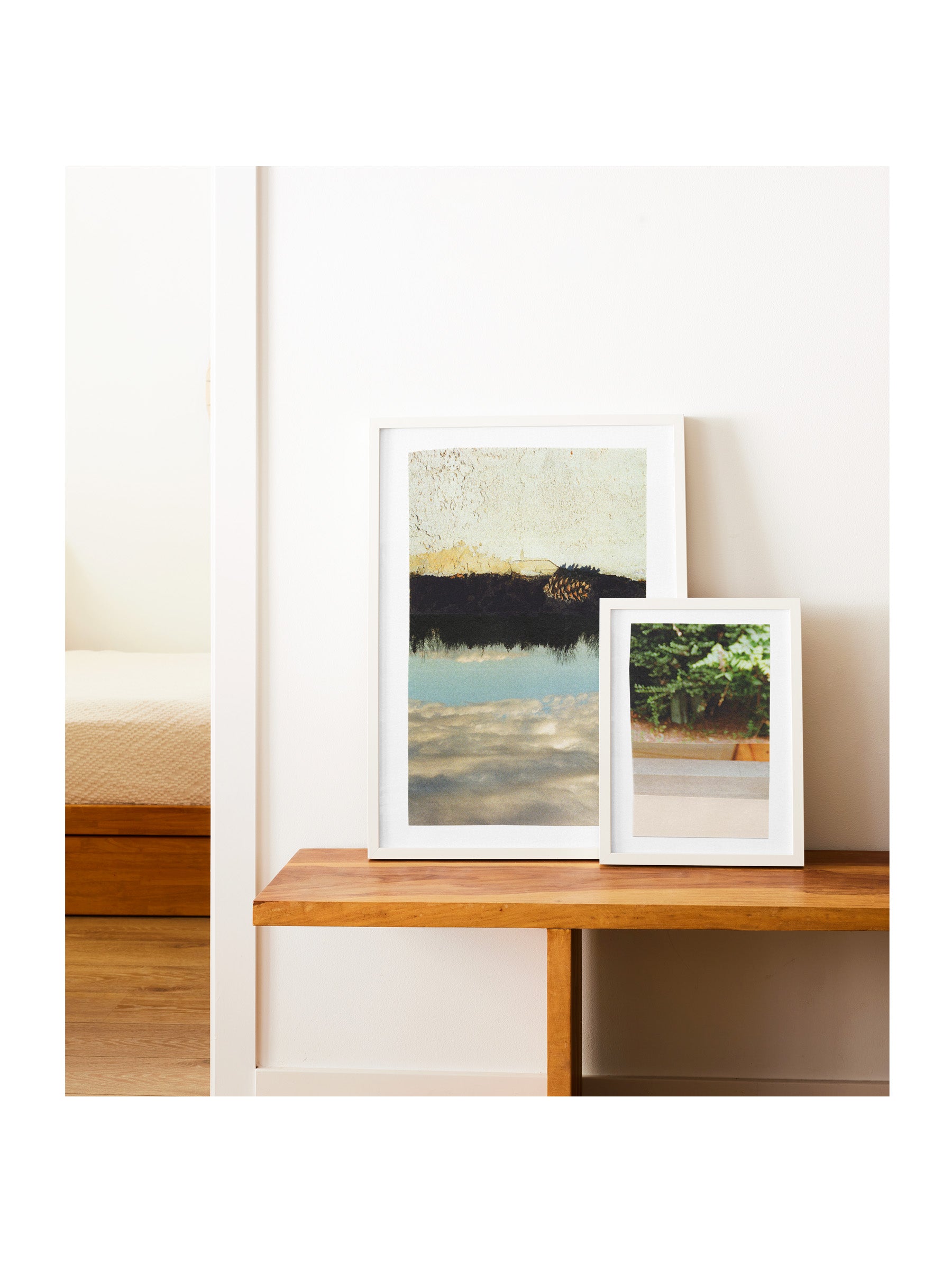 Sky and Foliage abstract photo collage prints displayed together on a wooden bench, framed in white — 16x20 and 8x10 giclée print duo by Libby Saylor