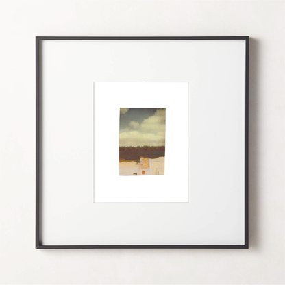 Abstract photo collage artwork featuring a landscape in warm ochre and cream tones in a black frame.