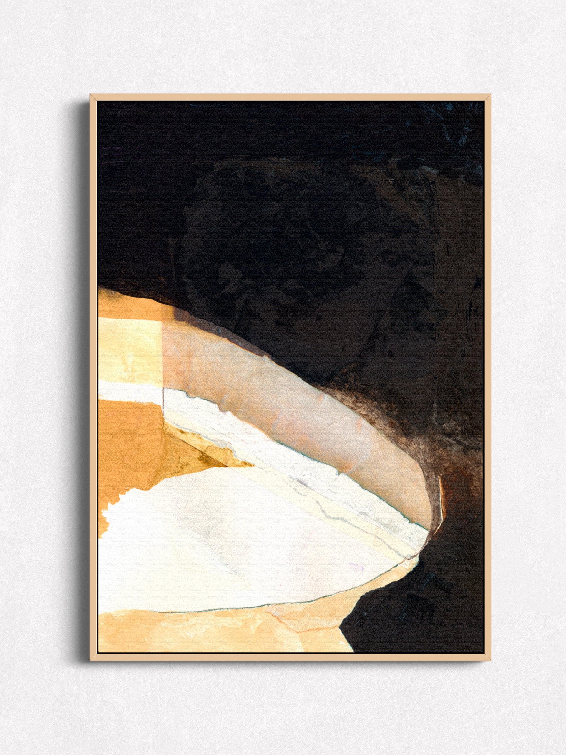 Abstract painting with black, white, and gold colors in an oak floater frame.