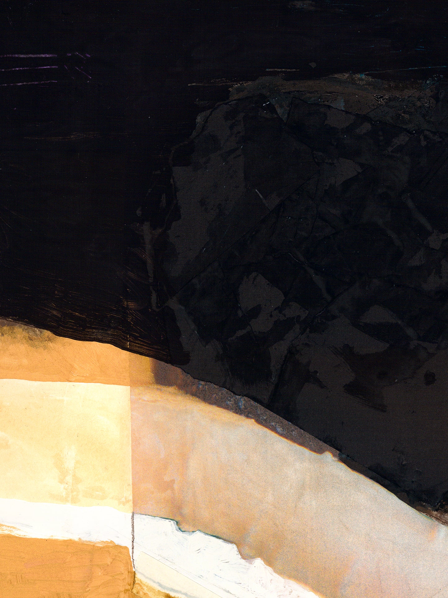 Close-up of a textured black surface with a beige border