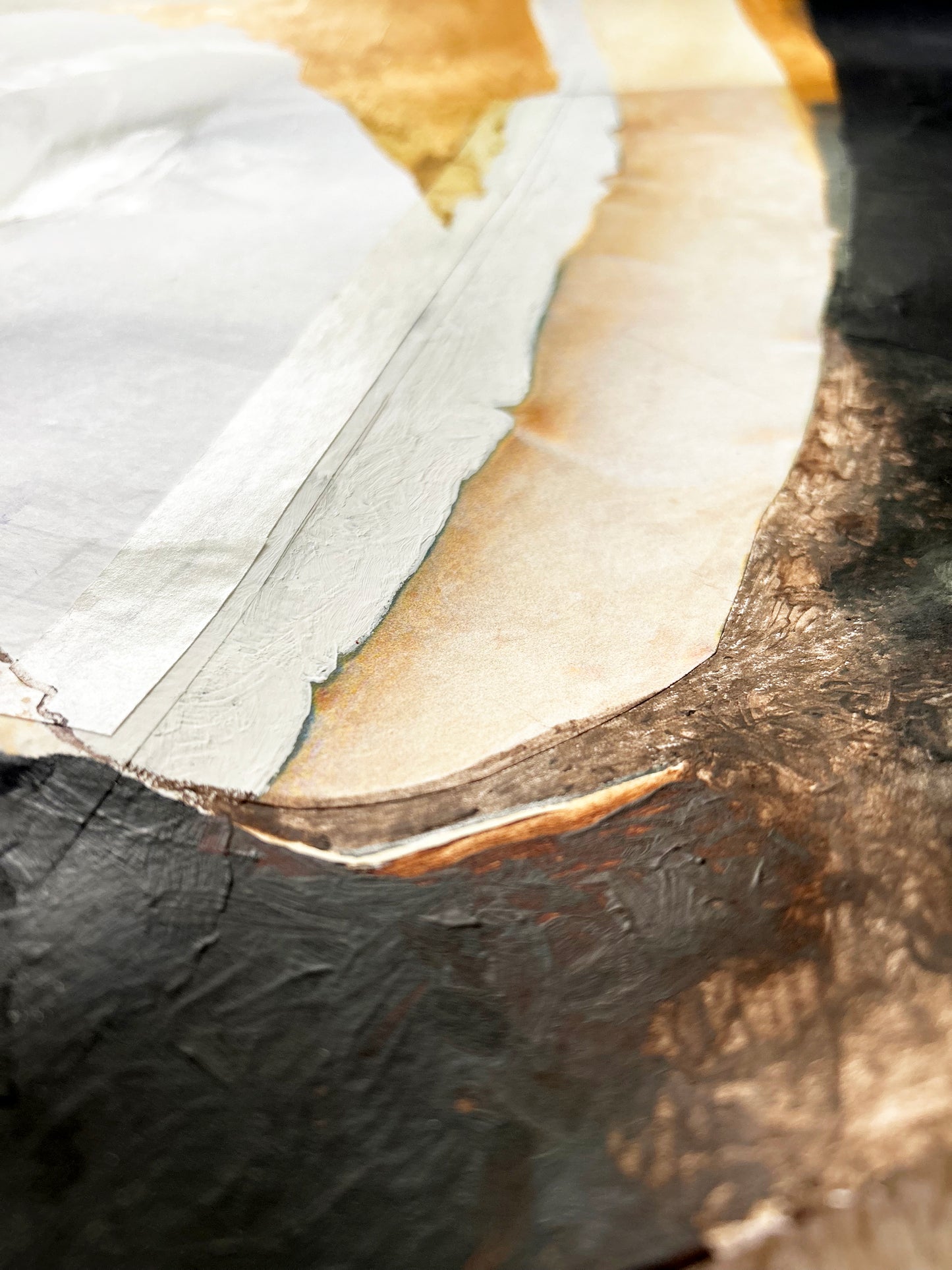 Close-up of a painting with a focus on the surface texture.