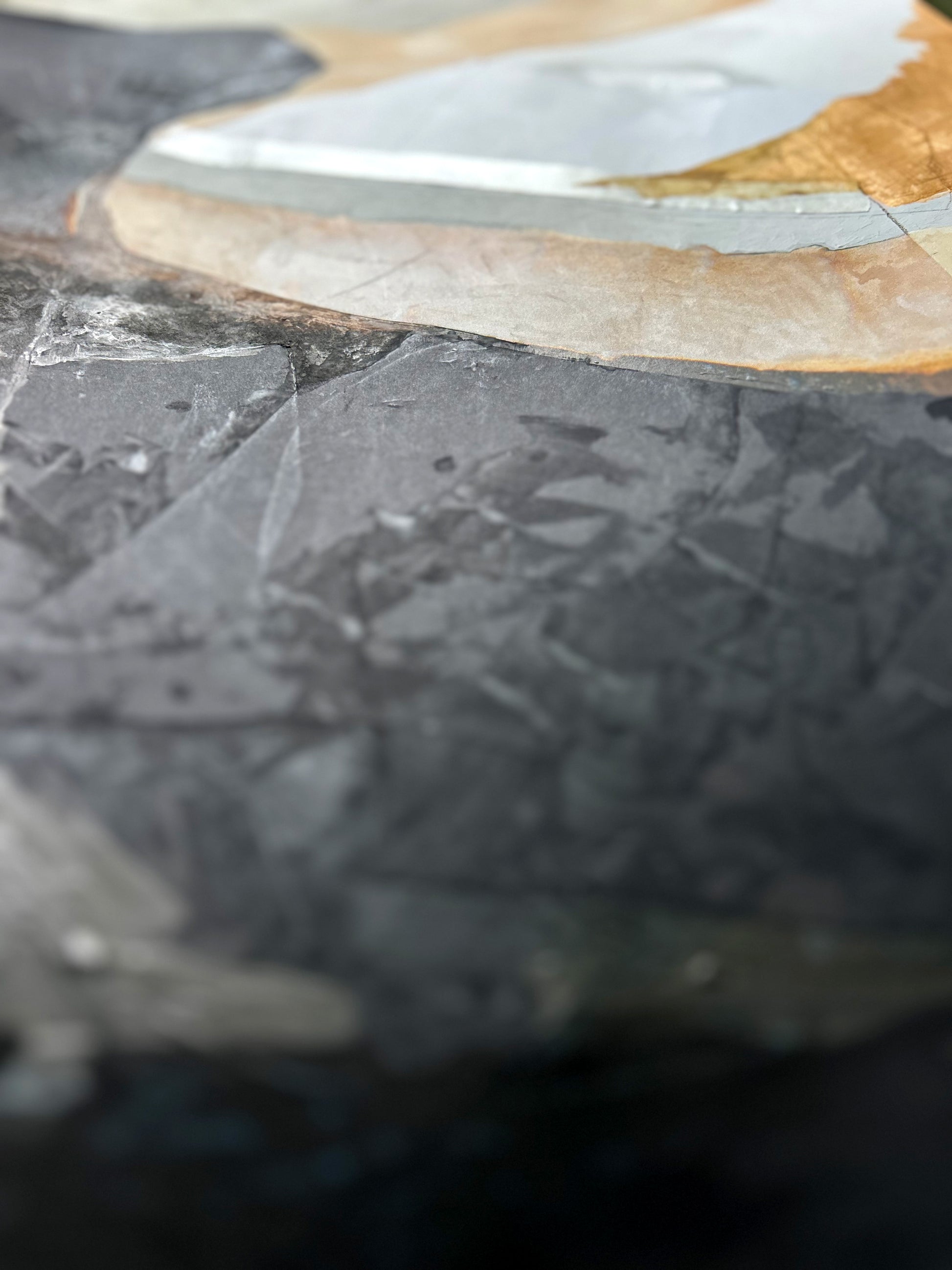 Close-up of a textured surface with of an abstract painting.