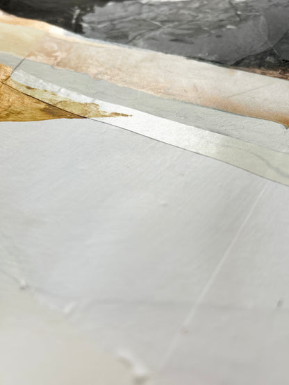Close-up of an abstract painting with a sheen of light.