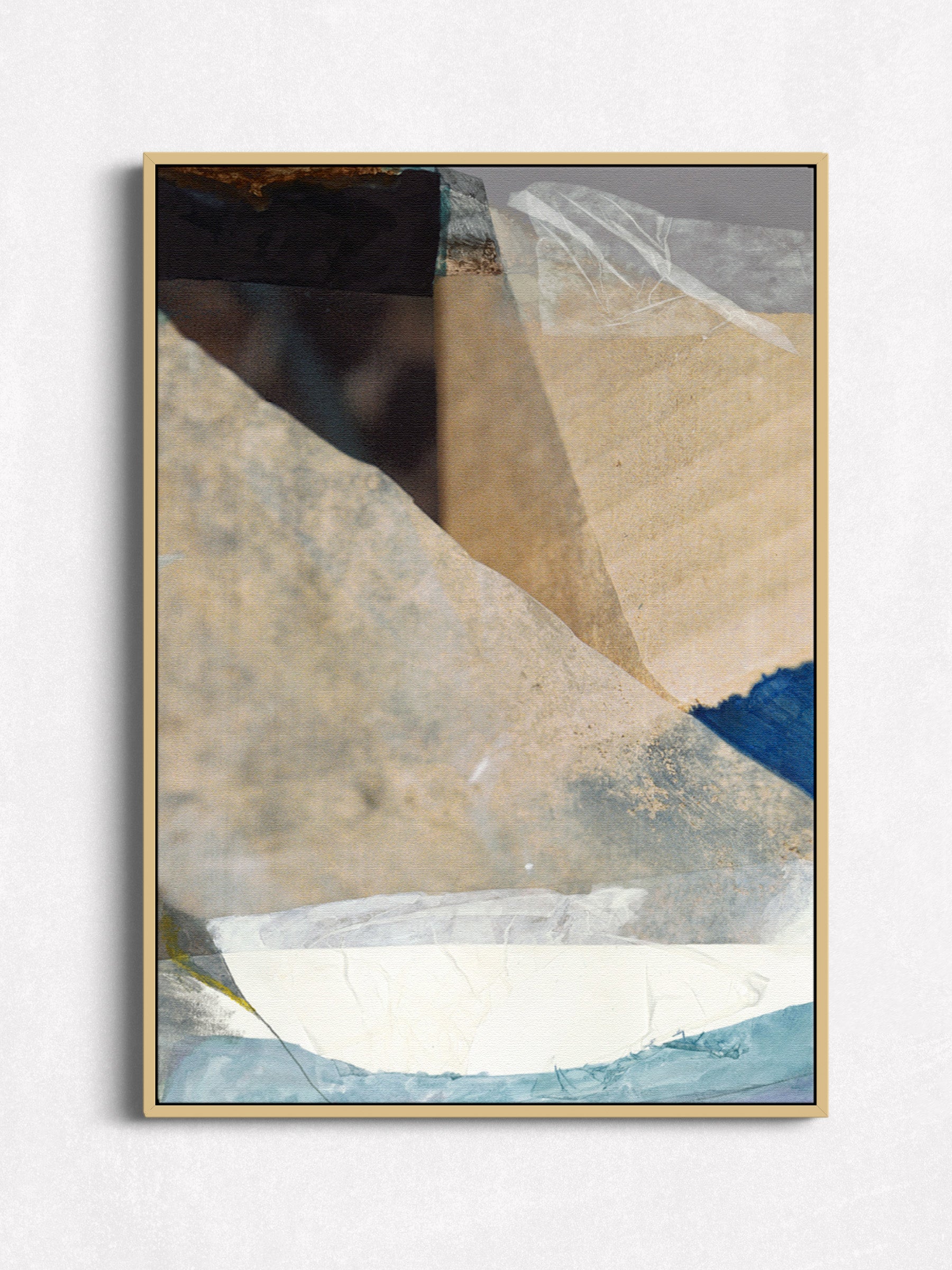 Abstract collage print in oak floater frame, full-bleed warm beige and sand tones with cobalt blue and white