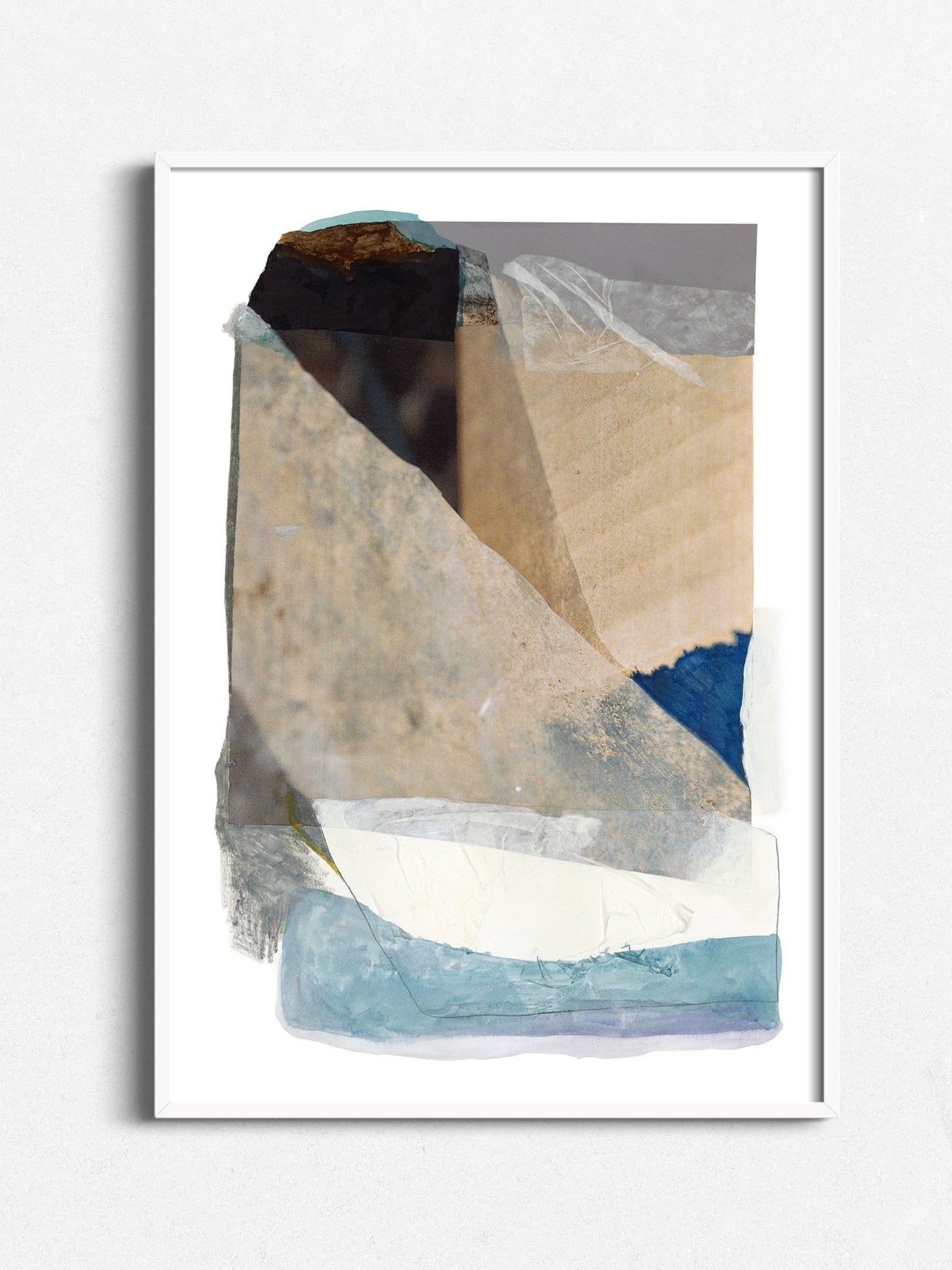 Abstract collage print in white wood frame, warm sand and kraft tones, cobalt blue accent, white border
