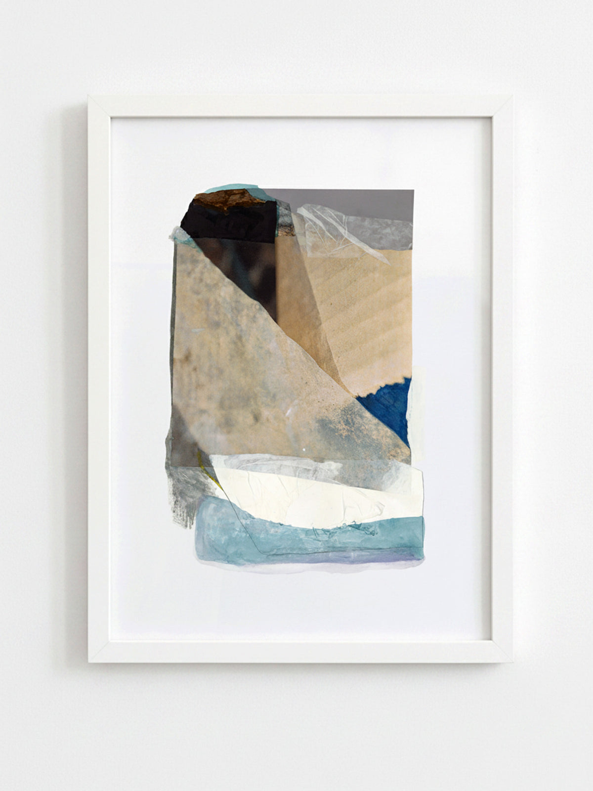 A framed abstract art print featuring layered geometric shapes and textures in beige, blue, white, and black, presented in a white frame against a light gray wall.