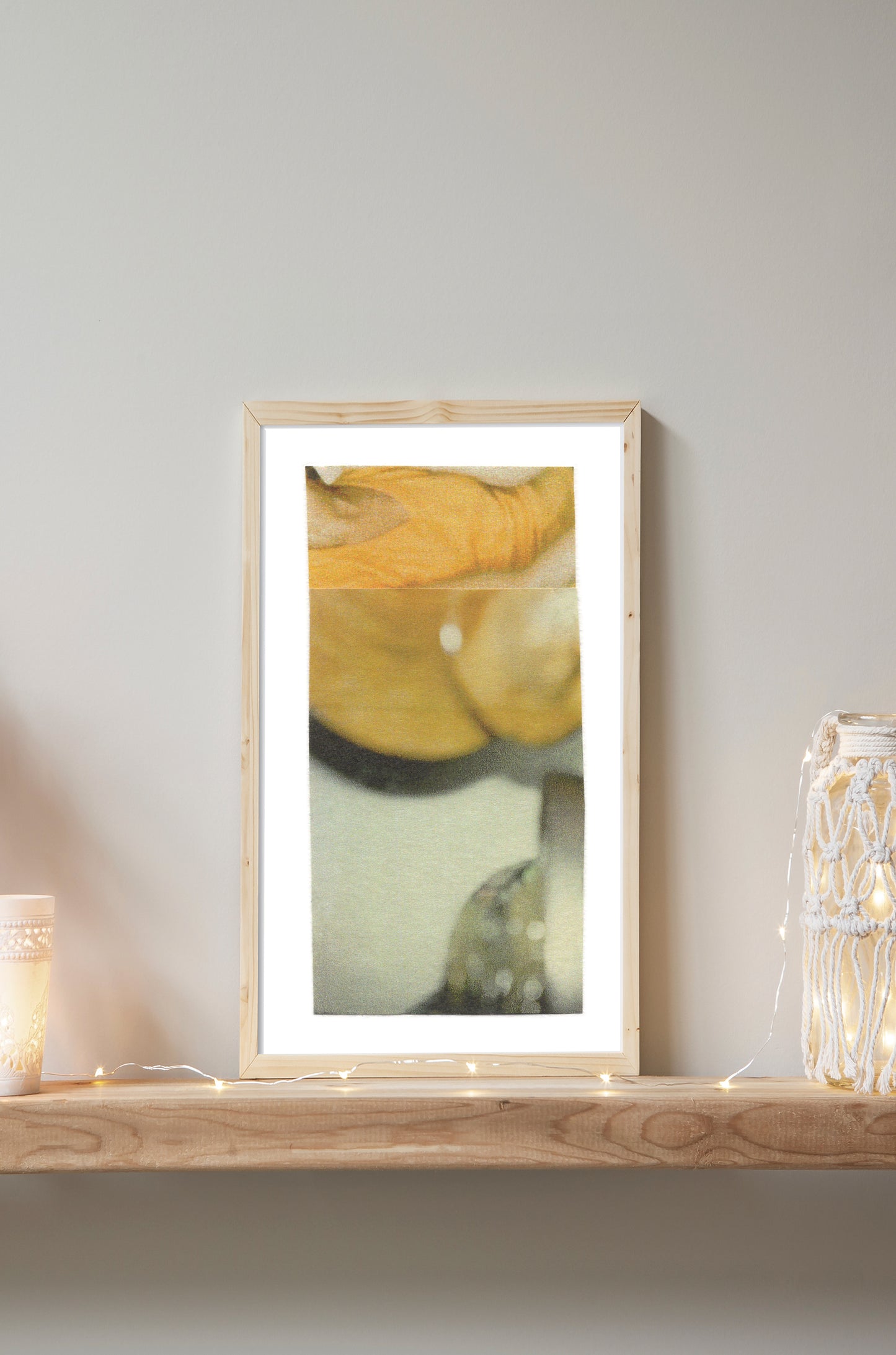 Yellow, gold, and sage green abstract photo collage on paper in a wooden frame.