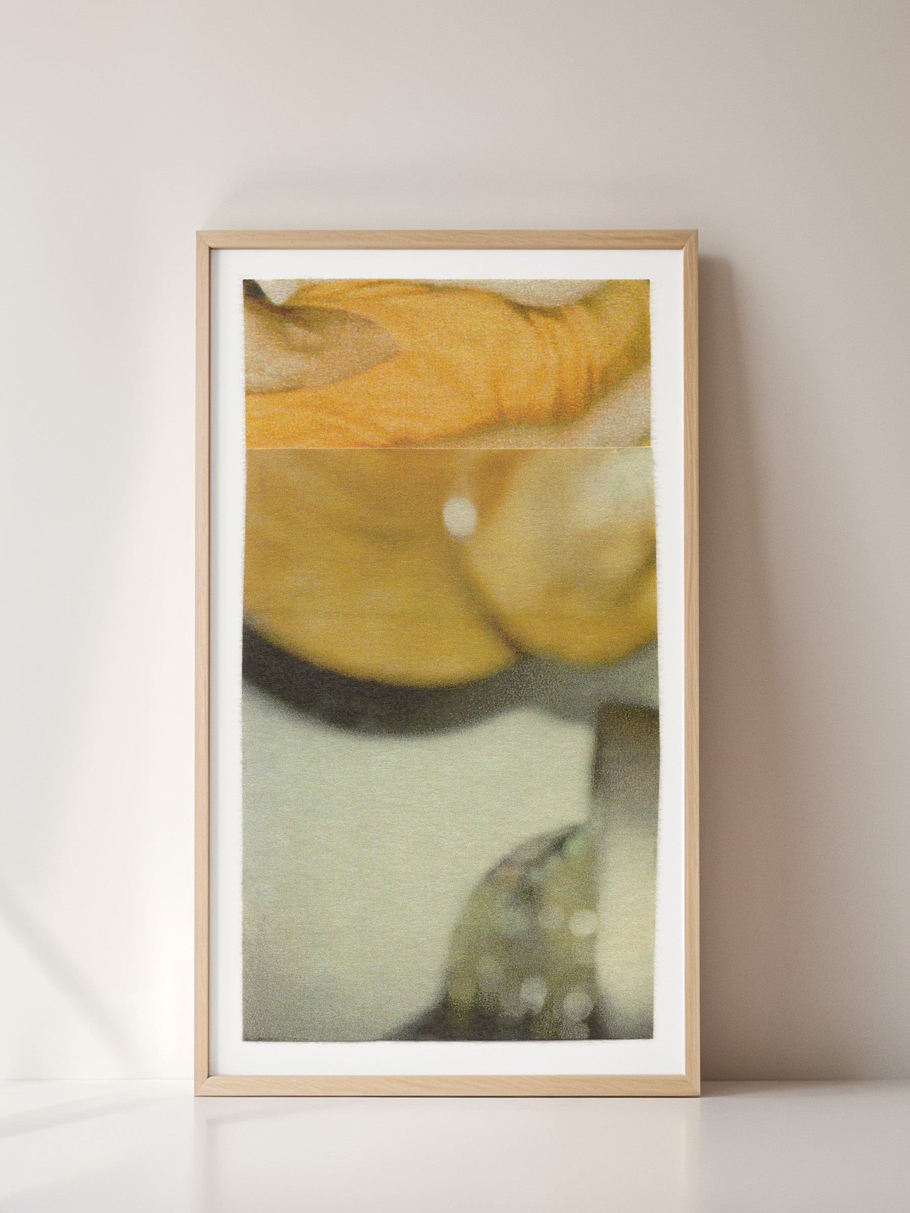 Yellow, gold, and sage green abstract photo collage in a wooden frame.