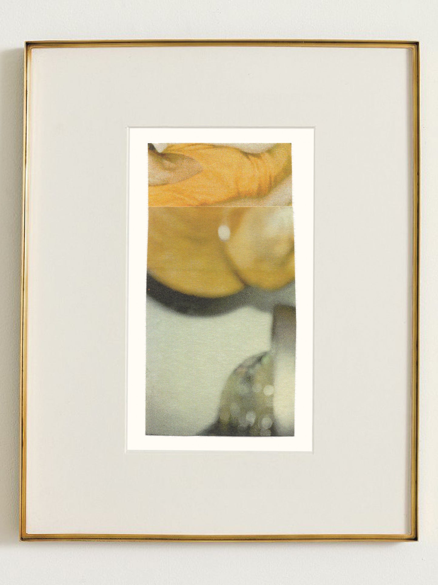 Abstract photo collage artwork with warm golden-yellow tones and soft grayish green and white elements in a gold frame.