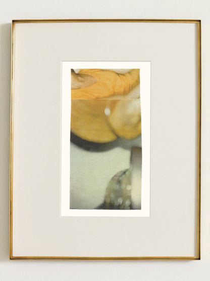 Abstract photo collage artwork with warm golden-yellow tones and soft grayish green and white elements in a gold frame.