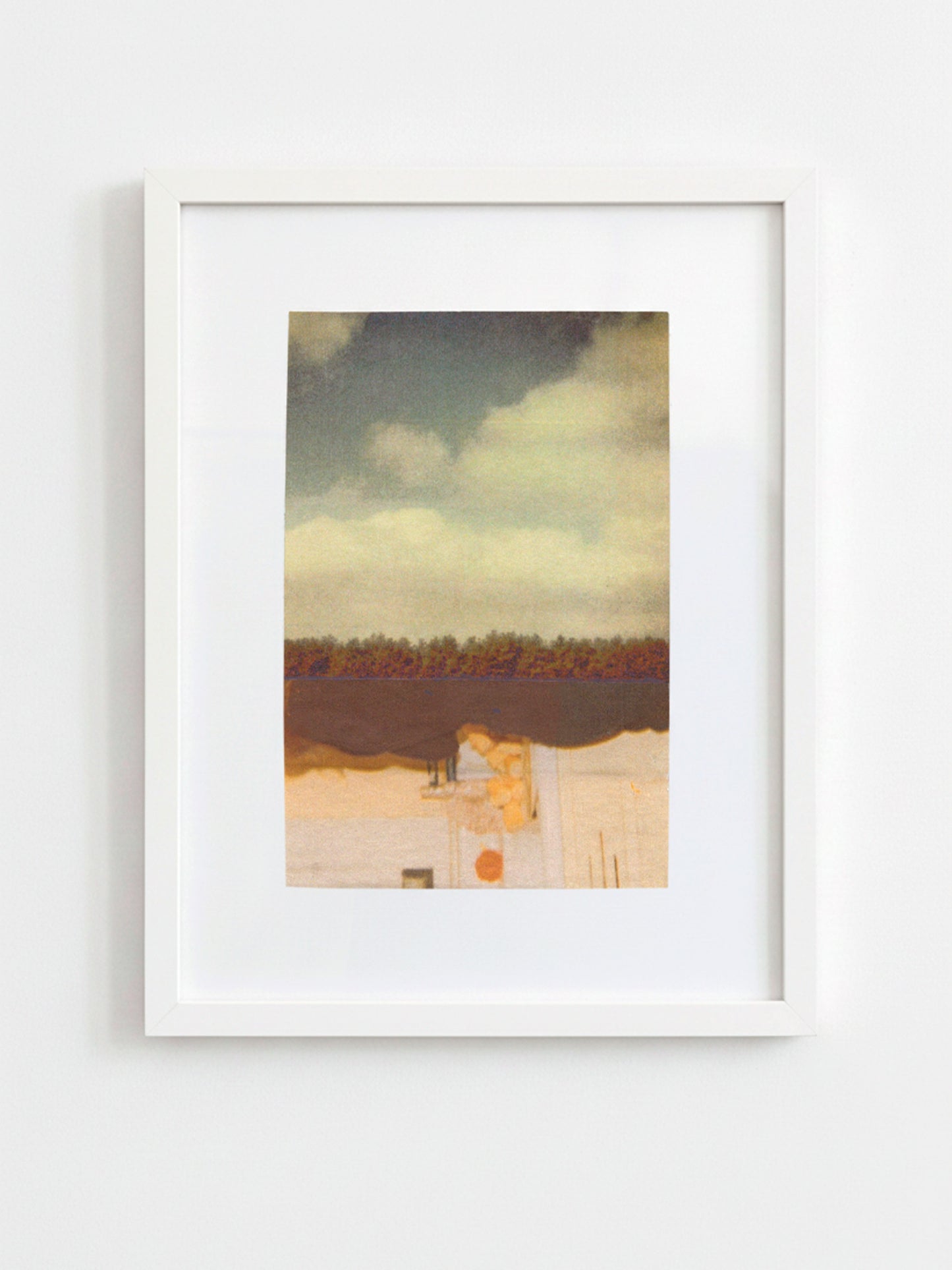A framed art print featuring an abstract landscape painting with a cloudy sky, dark horizon, and warm-toned foreground, displayed in a white frame against a light gray wall.