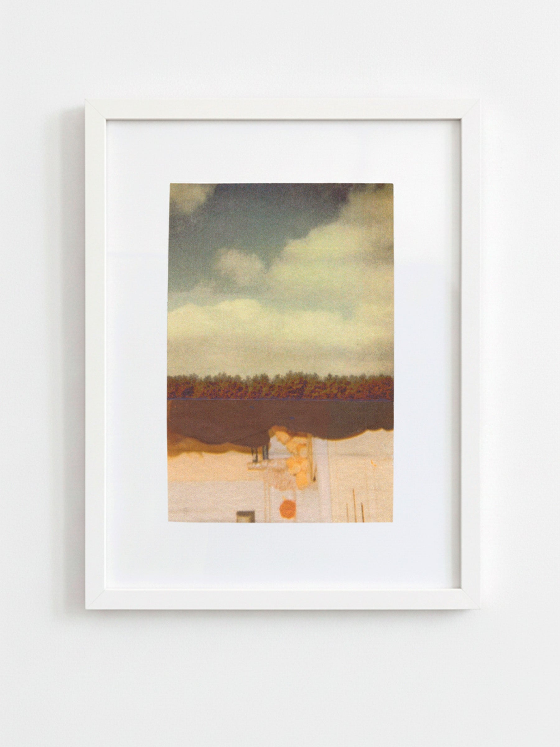 A framed art print featuring an abstract landscape painting with a cloudy sky, dark horizon, and warm-toned foreground, displayed in a white frame against a light gray wall.