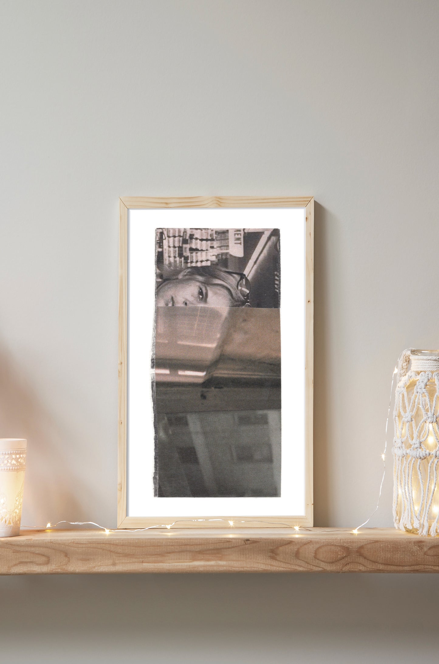 Framed black and white photo collage of a woman with a cityscape background.