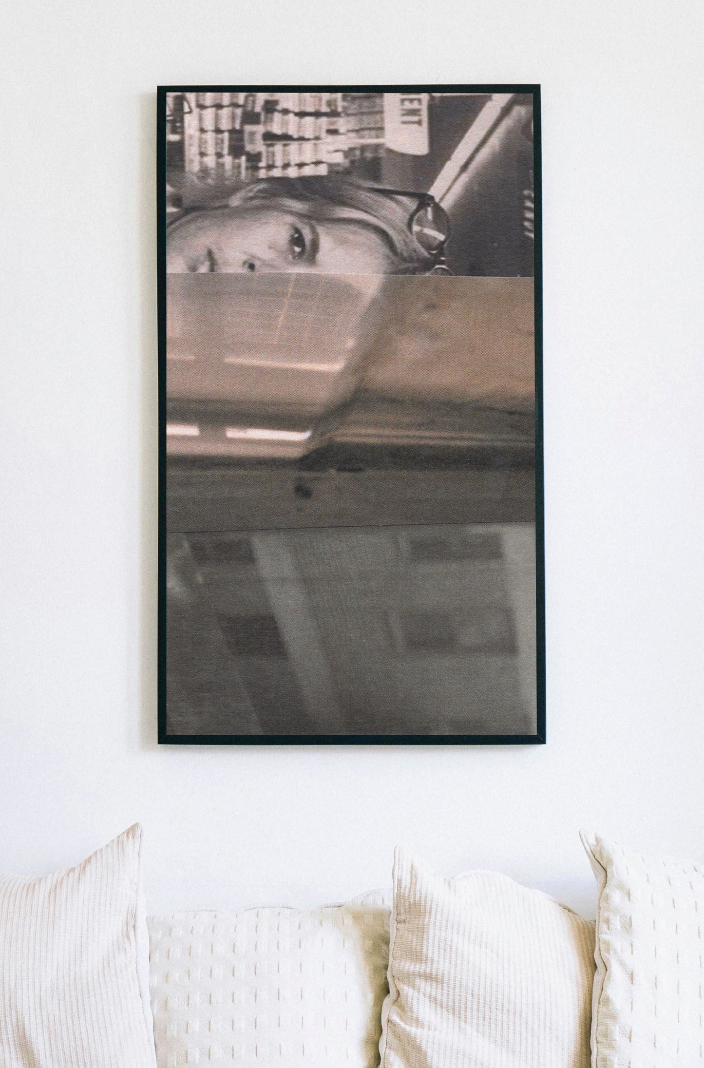 Framed canvas print of black and white photo collage of a woman with a cityscape.