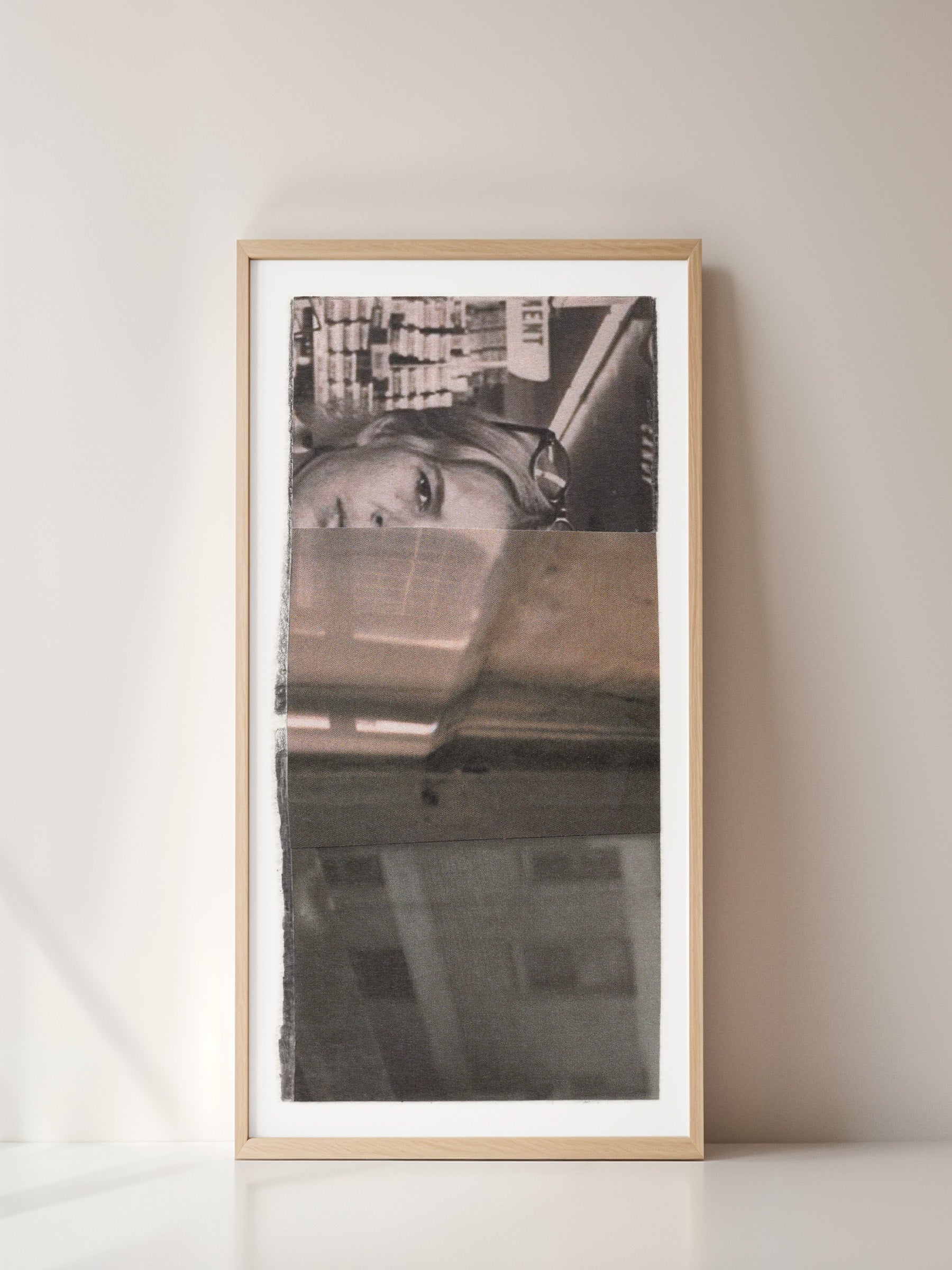 Framed black and white photo collage of a woman with a cityscape background.