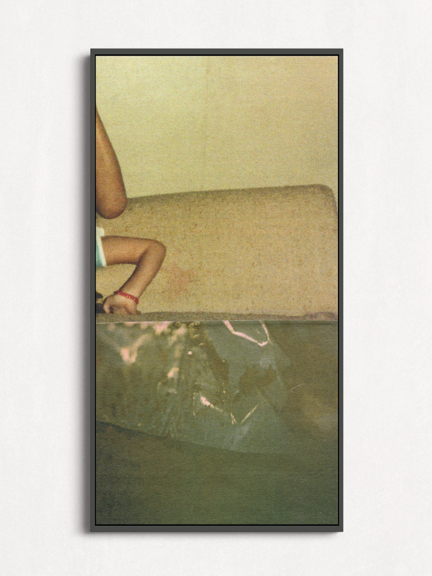 Framed print of sage green abstract photo collage with an upside down small child.