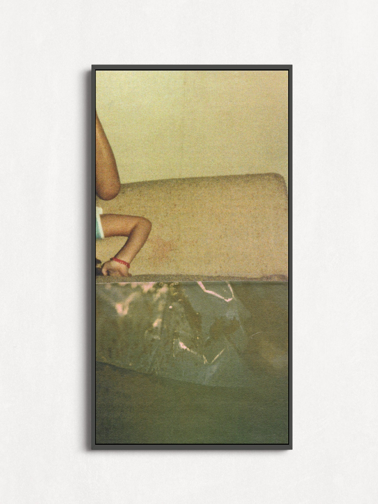 Framed print of sage green abstract photo collage with an upside down small child.