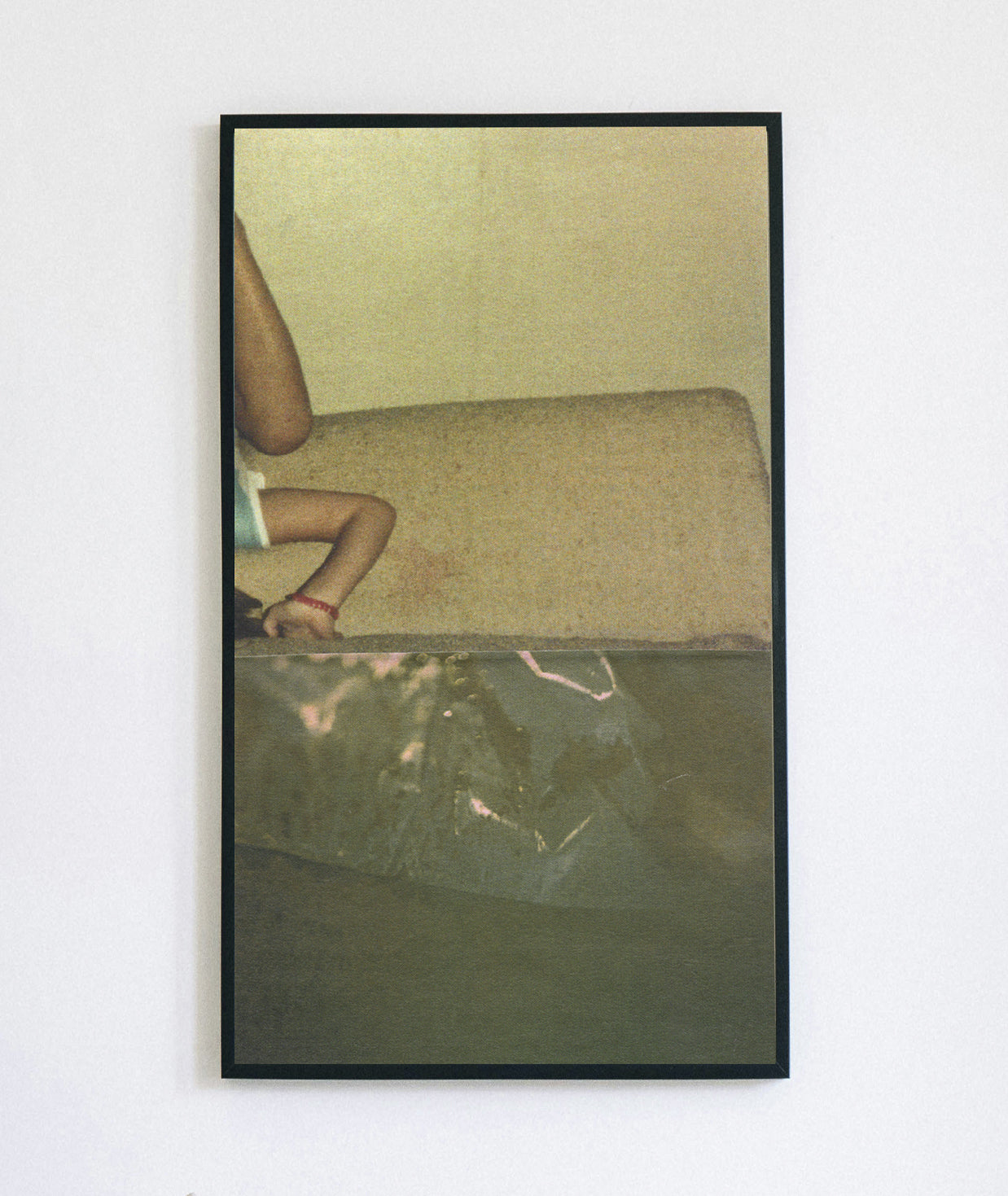 Framed print of sage green abstract photo collage with an upside down small child.