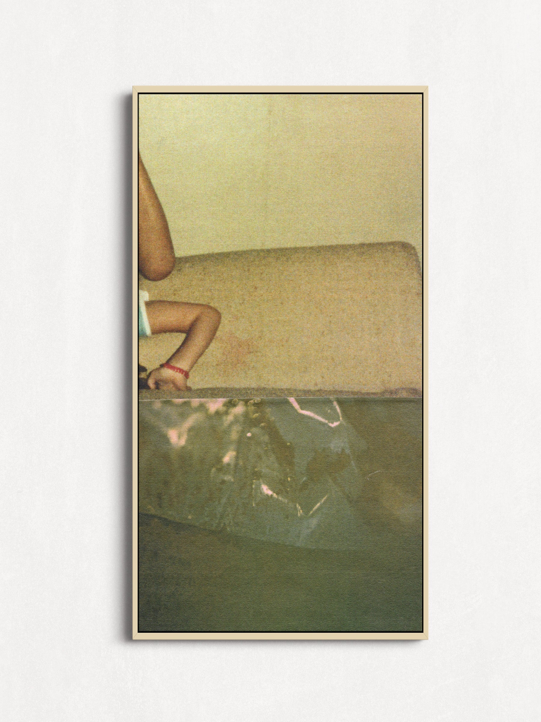 Sage green abstract photo collage with an upside down small child in an oak floater frame.