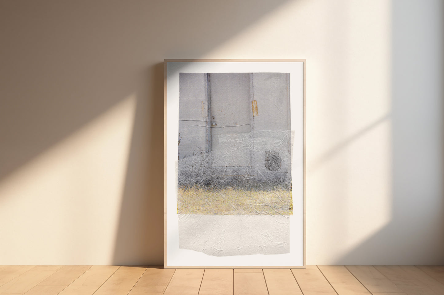 Large-scale gray abstract collage with soft earth tones and a textured surface in a wood frame.