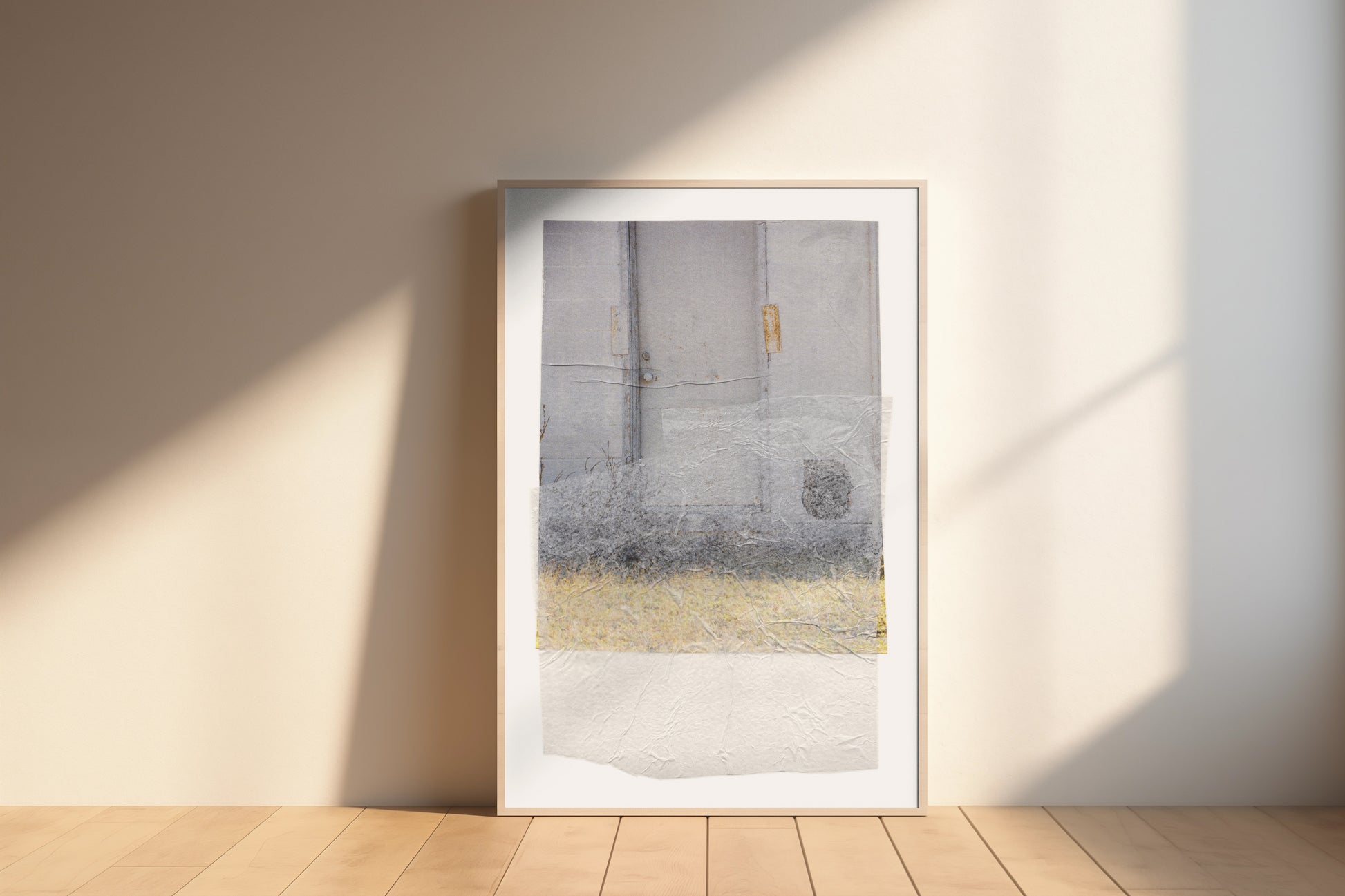 Large-scale gray abstract collage with soft earth tones and a textured surface in a wood frame.