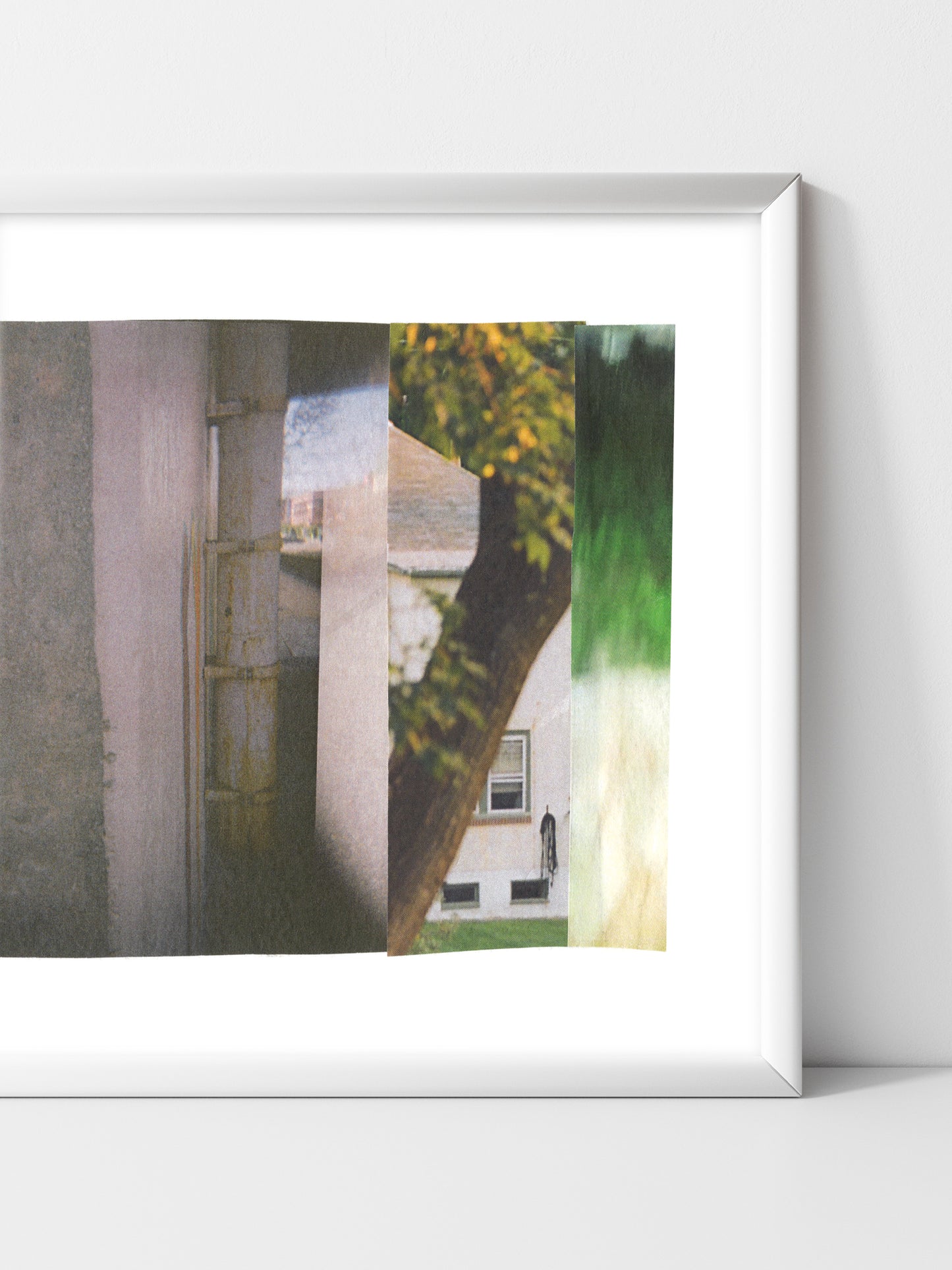 Abstract photo collage with gray tones and green nature imagery in a white frame.