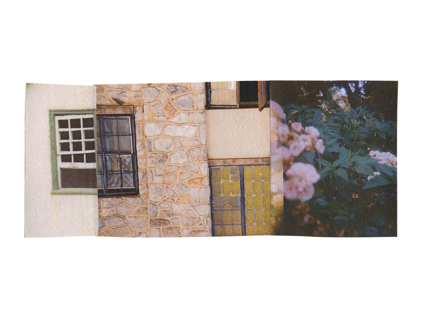 Pink, green, and cream collage of a stone wall with windows, a door, and flowers.