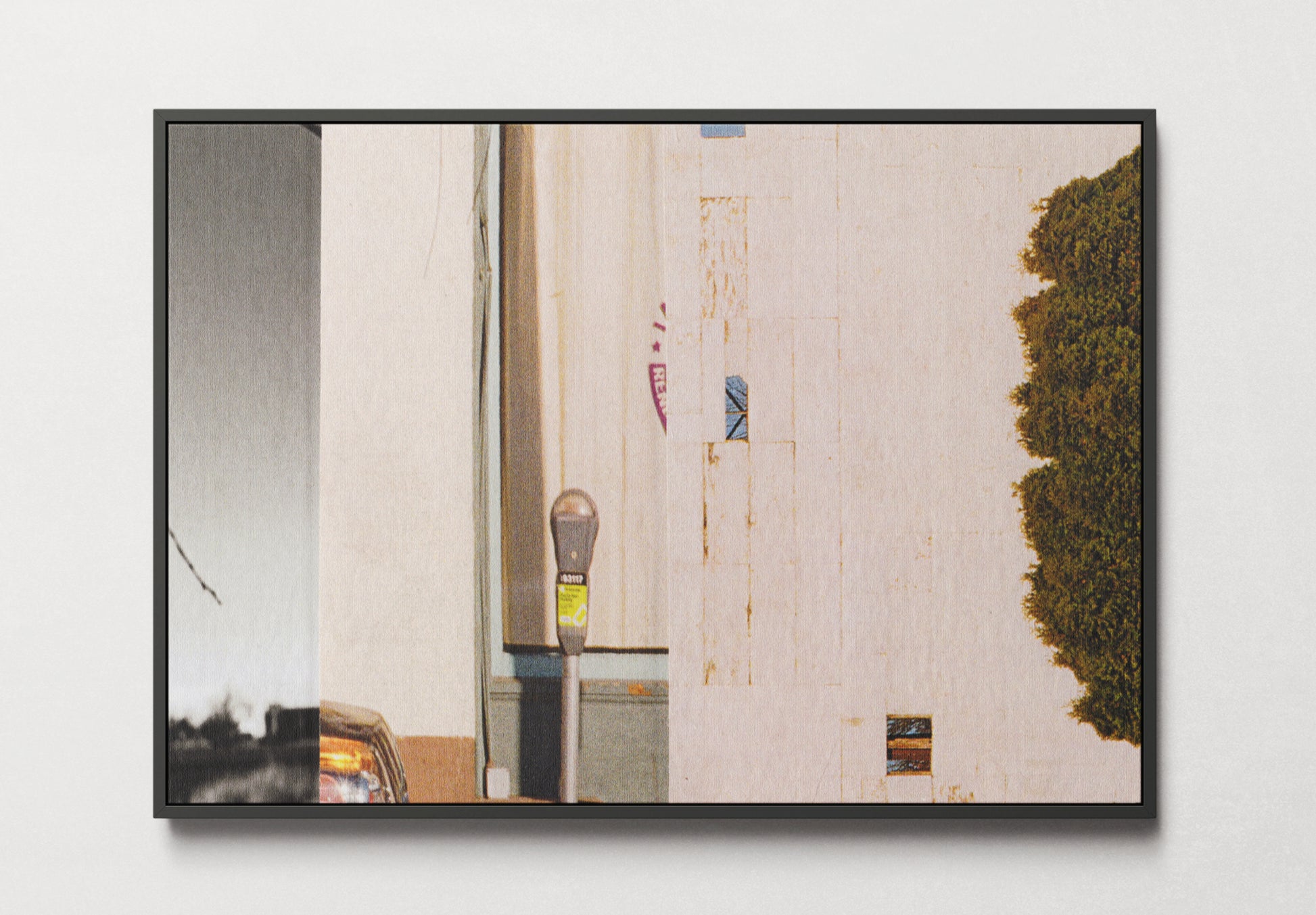 Framed canvas print of photo collage with urban and nature imagery and neutral tones.