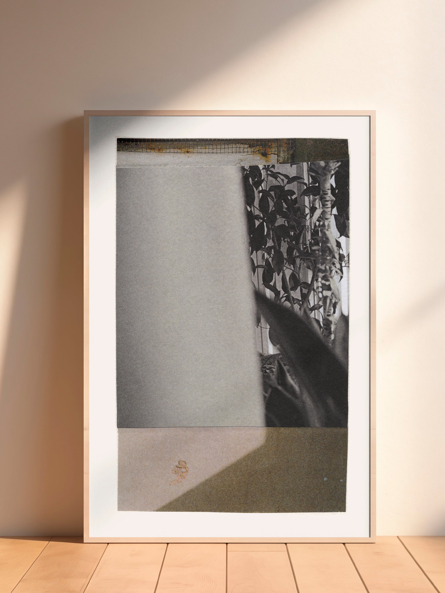 Black and white abstract mixed media collage art with leafy plants in wood frame.