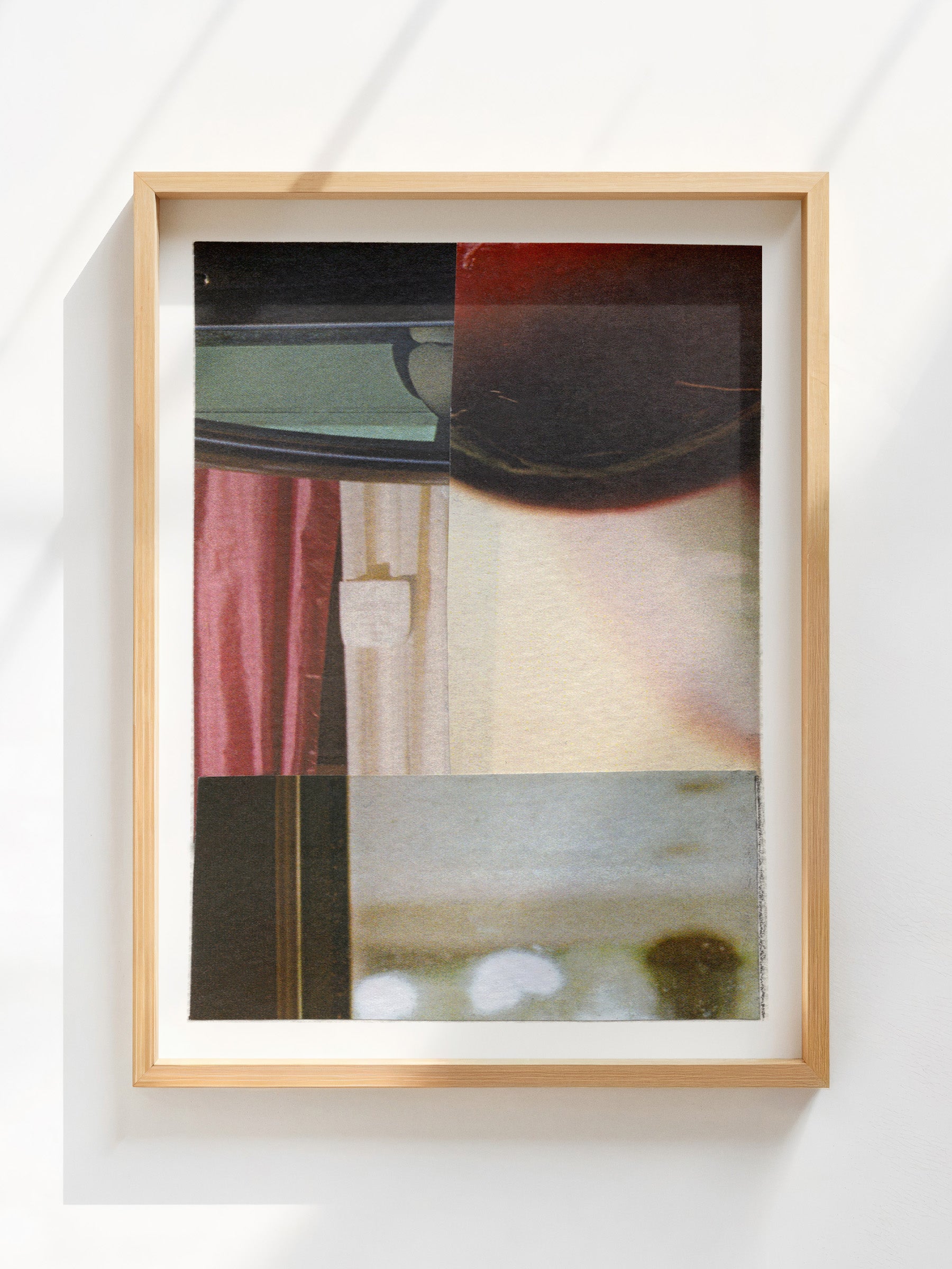 Framed abstract collage with geometric shapes and burgundy, cream, and black tones.