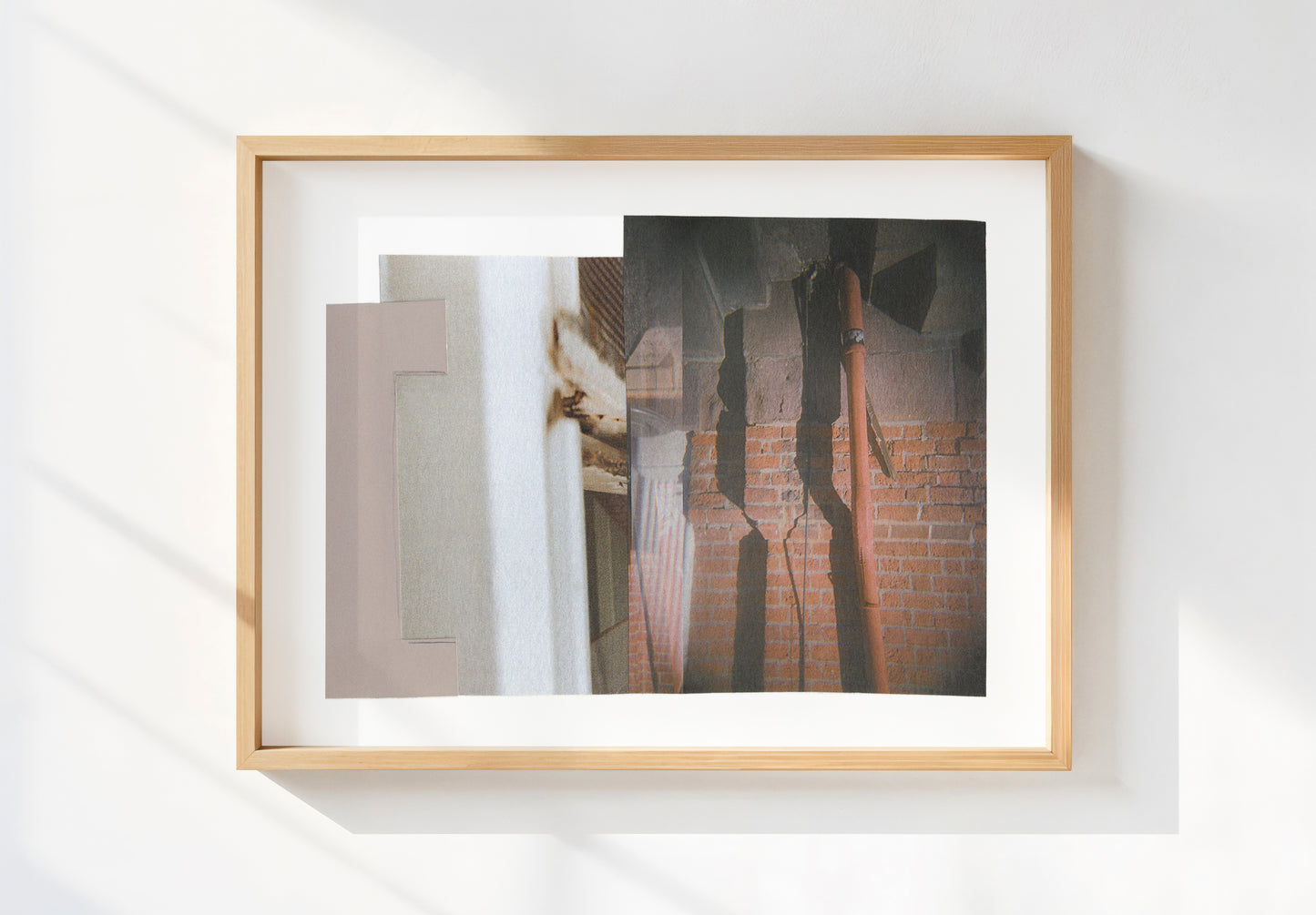 Framed abstract mixed media collage with geometric shapes and shadows in neutral tones.