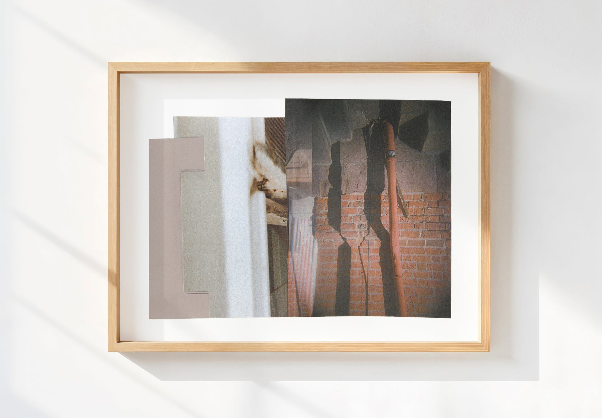 Framed abstract mixed media collage with geometric shapes and shadows in neutral tones.