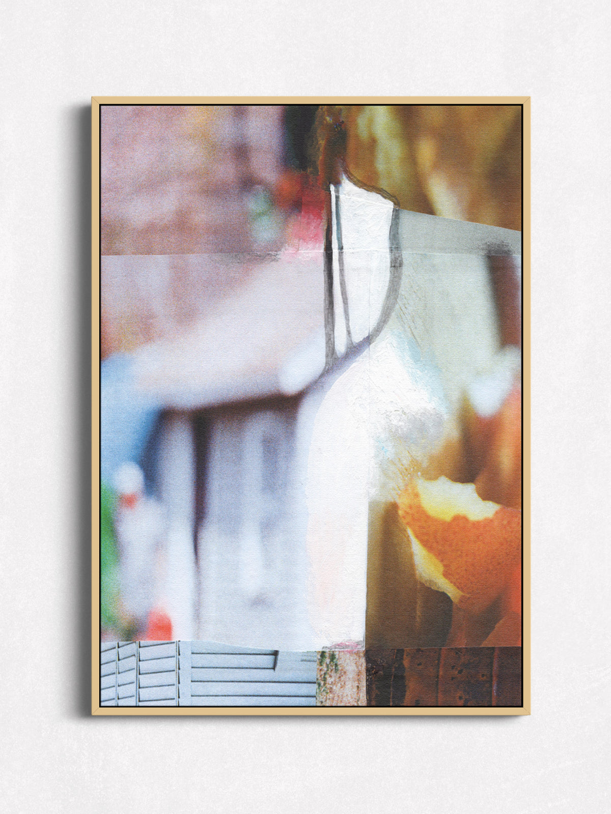 Photo collage in oak floater frame — warm amber, cream, and blush tones with dark drip details