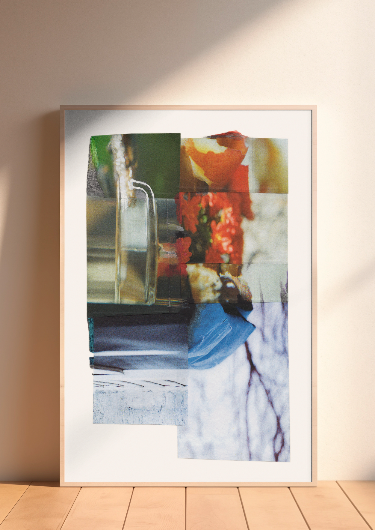 Framed colorful abstract collage with glass, flowers, and abstract patterns.