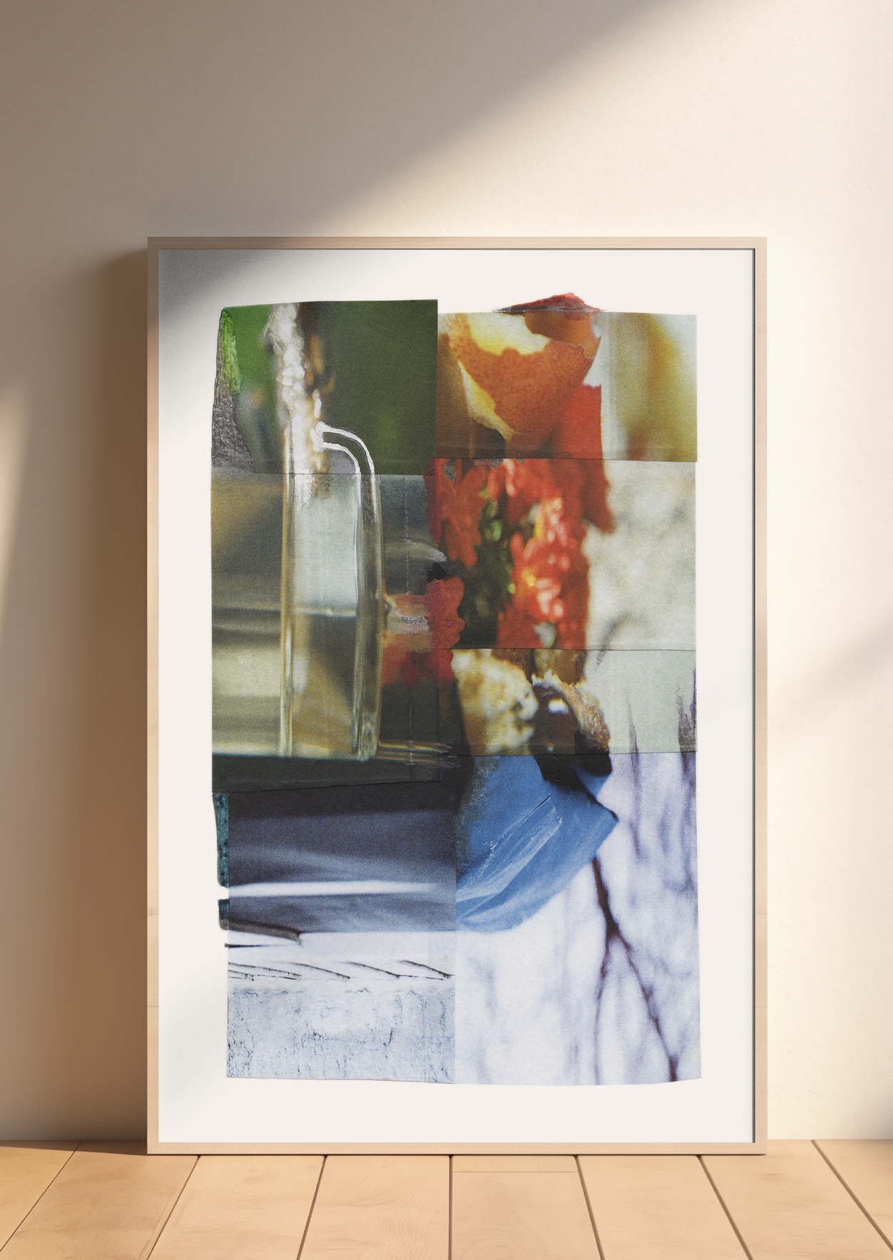 Framed colorful abstract collage with glass, flowers, and abstract patterns.