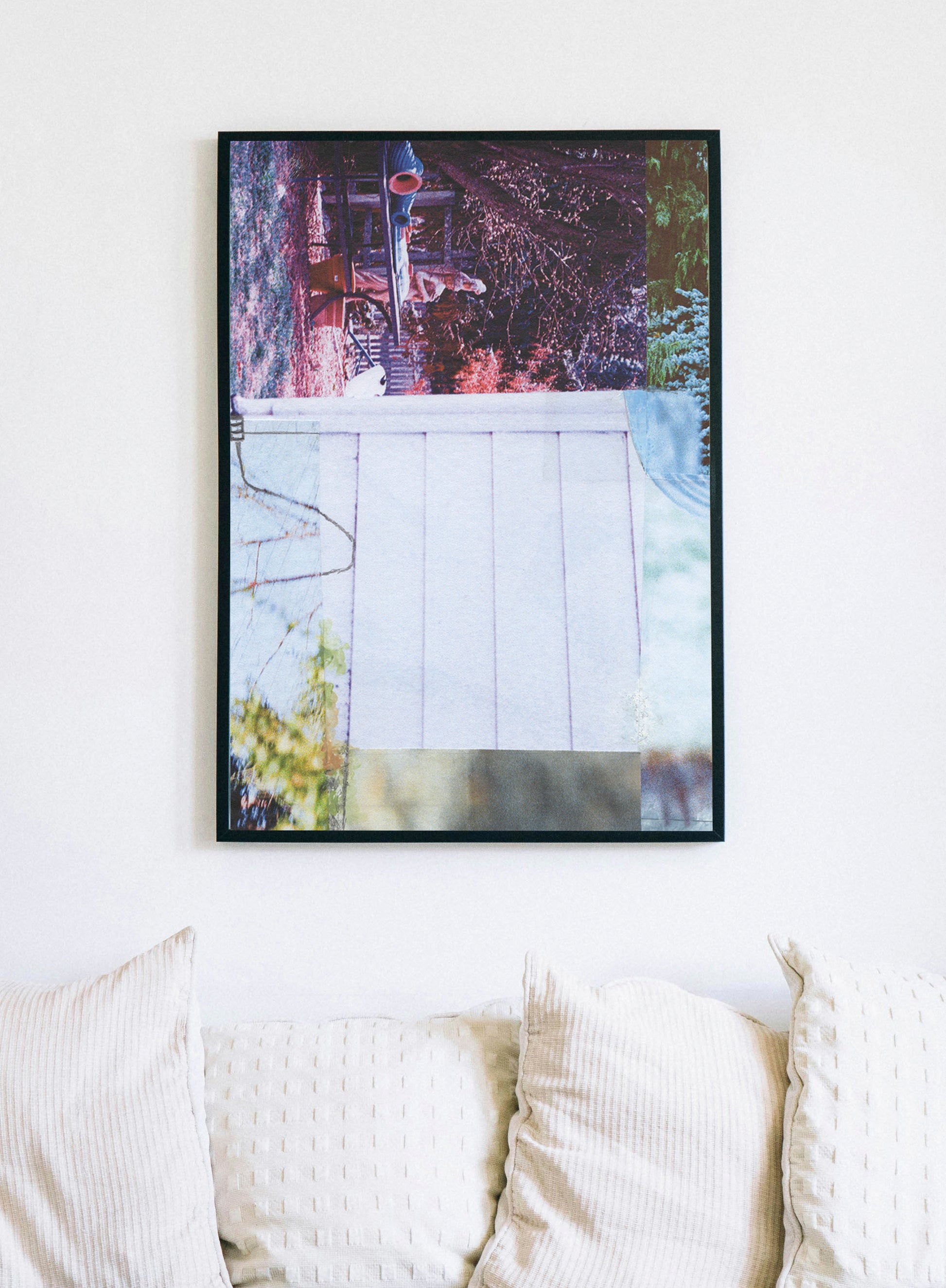 Framed canvas print of abstract collage with pink, purple, white, and green tones.