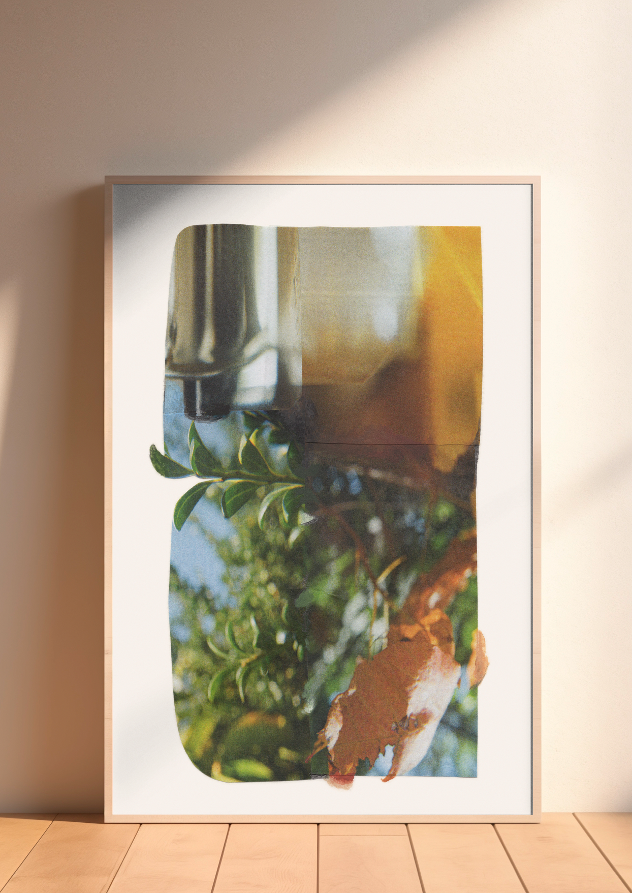 Framed abstract photographic collage with layered green botanical, amber, and blue.
