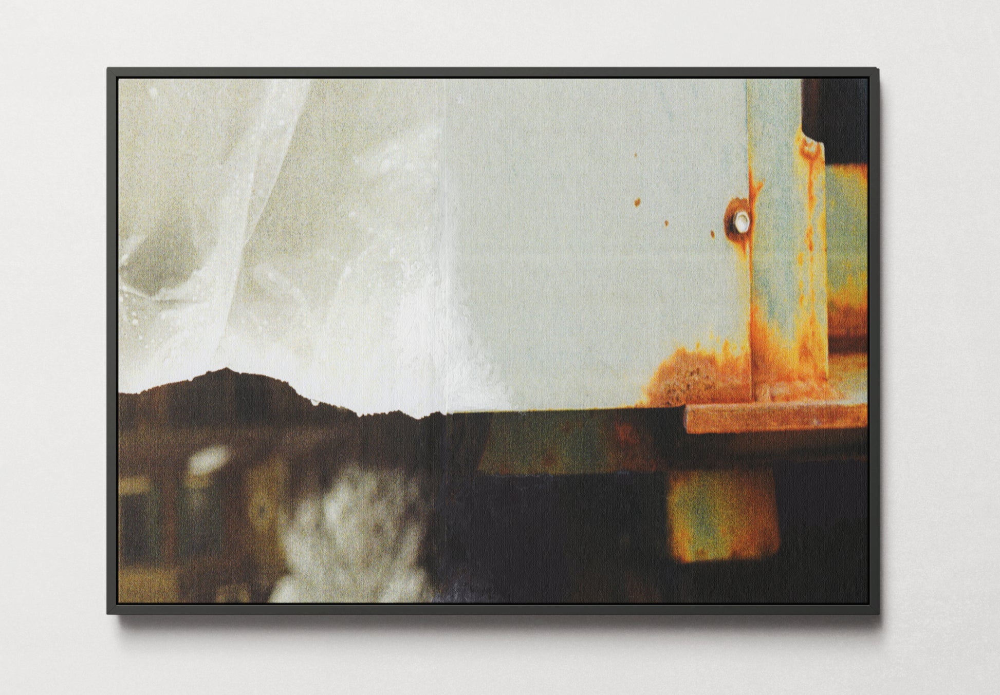 Black framed canvas print of abstract mixed media collage with neutral and amber tones.