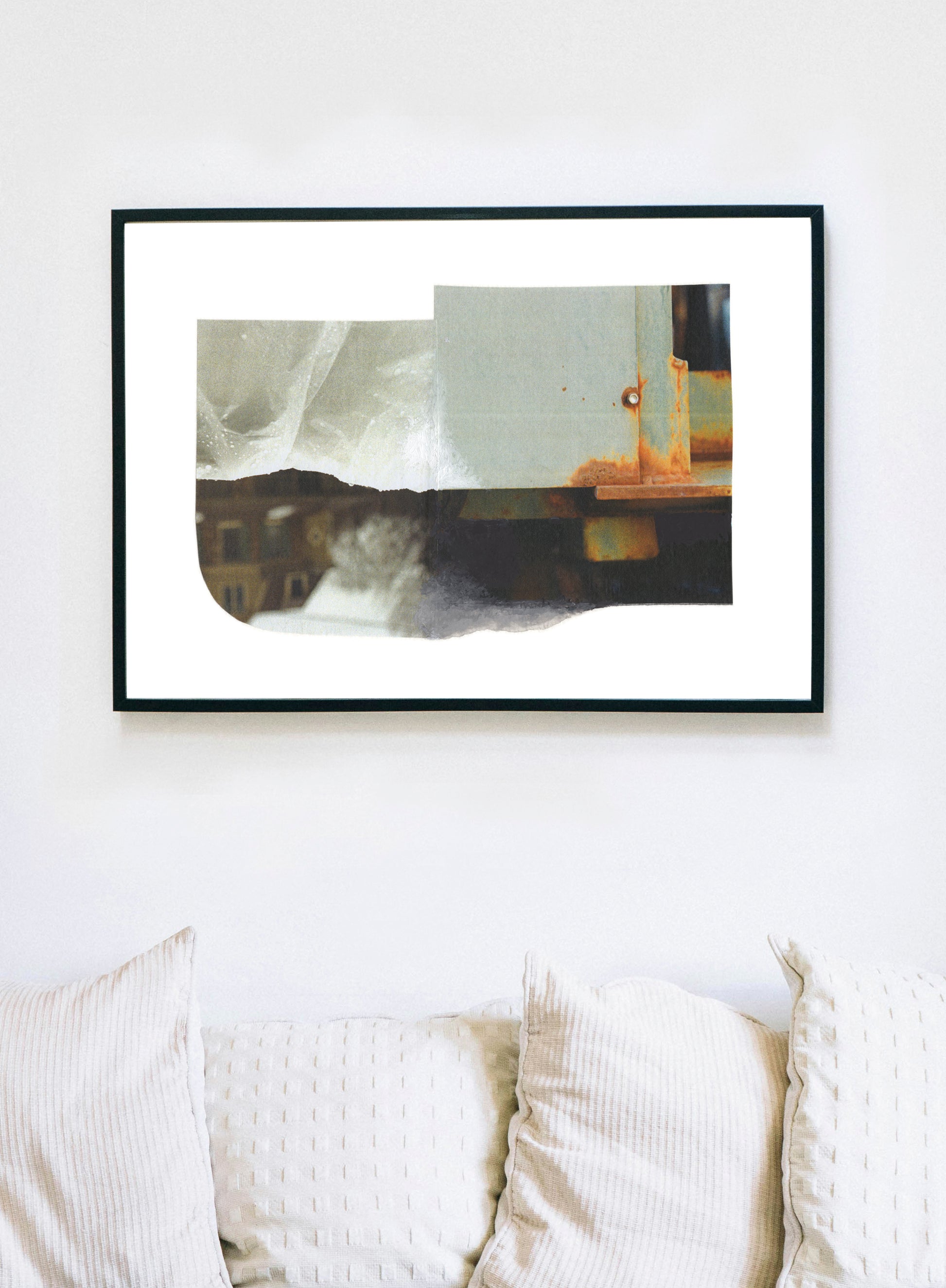 Abstract mixed media collage with neutral and amber tones in a black frame.