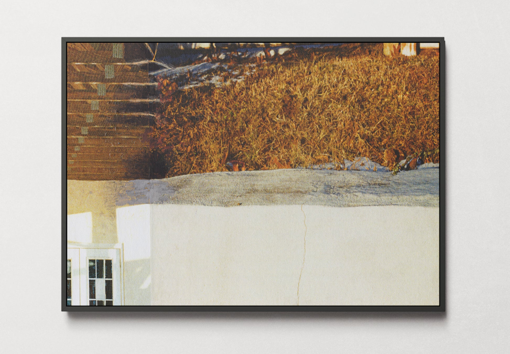Framed canvas print of photo collage with golden grass and a small window element. 