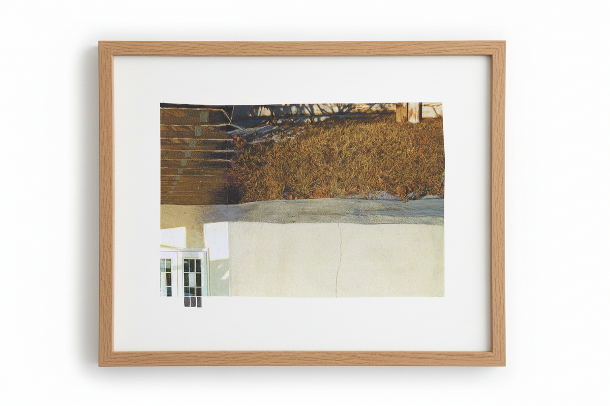 A framed art print featuring an abstract landscape with a brown textured hillside, a light beige wall, and a small white window, set in a light oak frame with a white mat on a white background.