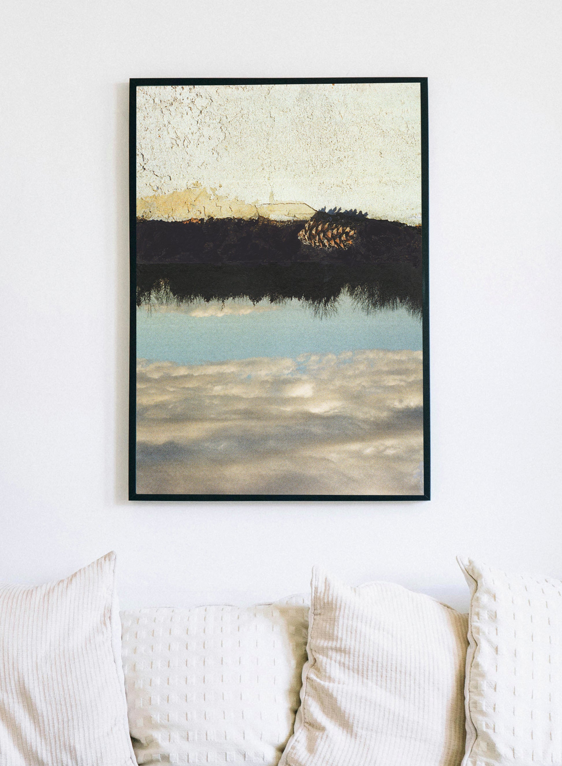 Framed canvas print of abstract collage with a landscape of stucco, trees, and sky with a pine cone.