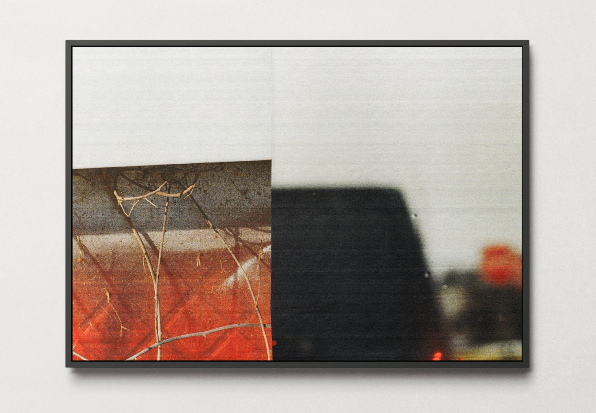 Framed canvas print of red, black and white abstract photo collage.