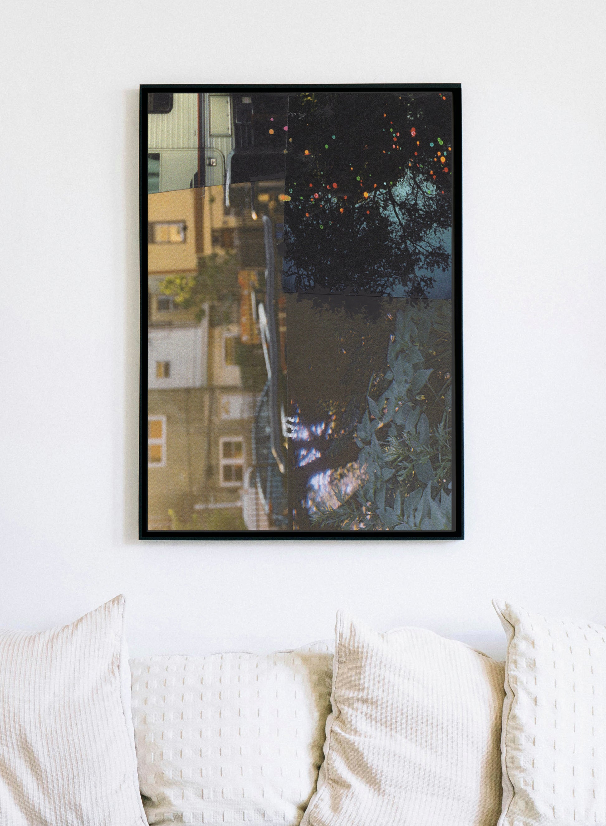 Abstract collage with architectural elements in dark blue, black, and earth tones in a black frame.