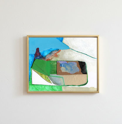An abstract framed painting on a white wall, featuring geometric and organic shapes in blue, green, beige, brown, and white, enclosed in a light wood frame.