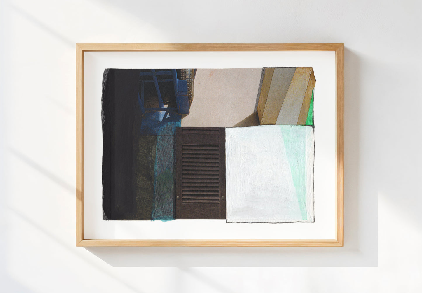 Framed print of abstract art piece with geometric shapes in blue, green, white, and black.