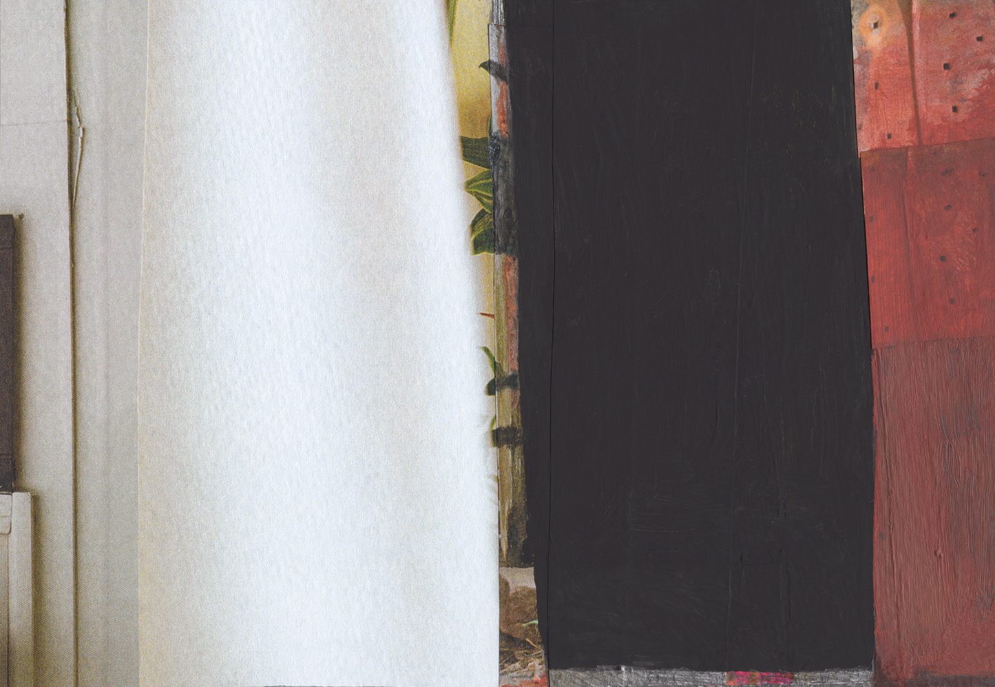 Detail of mixed media collage with rusty red, black, and white layers.