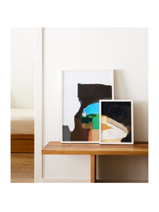 Homestead and Black Walnut abstract mixed media art prints displayed together on a wooden bench, framed in white — 16x20 and 8x10 giclée print duo by Libby Saylor
