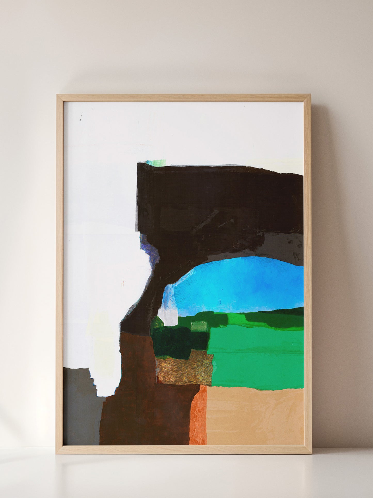 Colorful abstract landscape painting in a wooden frame on a beige wall